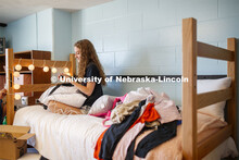 Breeana Read of Omaha plugs her phone charger in as she decorates her room. First day of residence h