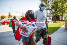 Lauren Lewis of Omaha carries in the last items for her Harper Hall First day of residence hall move