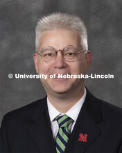Studio portrait of Justin Firestone, Assistant Professor of Practice, Jeffrey Raikes School. New Fac