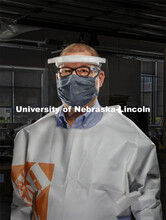 Bob Wilhelm, Vice Chancellor Research and Economic Development is wearing face shield and gown made 