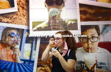 Caitlin Garcia of Papillion enjoys Dairy Store ice cream surrounded by other fans Thursday at the CA