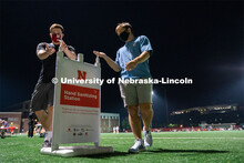 Two students make use of a hand sanitizing station while leaving Mabel Lee Fields at the conclusion 