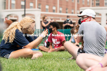 Freshman Meredith Game (left) takes a photo of Freshman Ian Mitchell (right) holding a goat during W