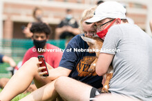 Freshman Meredith Game (left) and Freshman Ian Mitchell (right) take a selfie together with a goat d