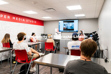 Students sit a social distance of six feet apart from one another inside of Andersen Hall during the