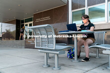 Freshman Journalism major Samantha Grove listens to a lecture through Zoom outside of Andersen Hall 