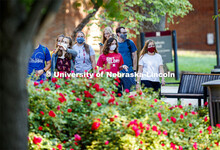 Students are masked up as they cross campus to get to their classes. First day for in-person learnin