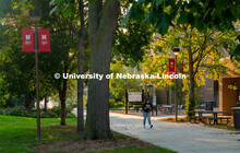 A young woman crosses East Campus on her first day for in-person learning of the fall semester. Augu
