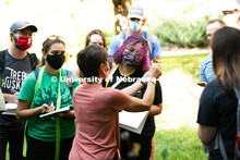 Deanne Moutanez gets a closeup view as Kim Todd displays a leaf from a plant in her Hort 214 Herbace
