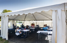 Law Professor Matt Schaefer teaches LAW 671 International Trade Law in a tent set up outdoors at the
