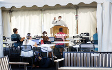 Law Professor Matt Schaefer teaches LAW 671 International Trade Law in a tent set up outdoors at the