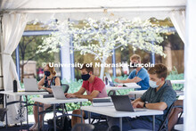 Law Professor Matt Schaefer teaches LAW 671 International Trade Law in a tent set up outdoors at the
