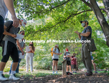 Students listen as Professor Eric North describes what feature to observe to identify this magnolia 