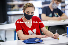 Kayla LaPoure listens to Anna Henson teach her Principles of Interactivity course in the Carson Cent