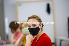 Kayla LaPoure listens to Anna Henson teach her Principles of Interactivity course in the Carson Cent