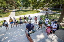 Students gather around Associate Professor of Architecture Jason Griffiths outside Architecture Hall