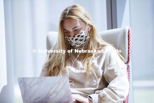 A young woman studies in the College of Business. First day for in-person learning for the fall seme