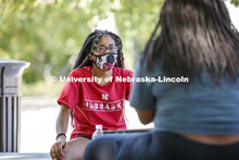 Serenity Loving and Vivian Berry catch up on the details of their first day on campus. First day for