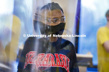 Kyra Baptiste of Topeka, KS, is reflected in an acrylic divider in her Chemistry 105 lab. First day 