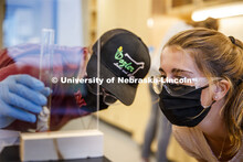 Breanna Reynolds and her lab partner, Cody Schaald observes the amount of dry beans they were weighi