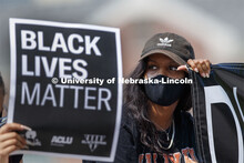 Batool Ibrahim holds one end of a Black Lives Matter banner at the sit-in sponsored by the Black Stu