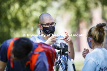 Walker Pickering explains camera settings to Lainey Ramaekers in the PHOT 161 - Photography for Non-