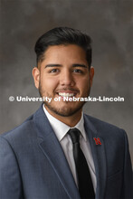 Studio portrait of Germán Ávila, Assistant Program Coordinator, OASIS and Jackie Guaghan Multicult