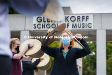 Cymbal practice comes to a crescendo as Caroline Nebel, a senior from Lincoln, and the rest of the c