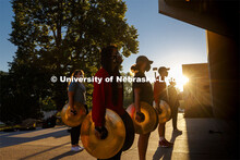 A sunrise serenade as the cymbals and bass line of the Cornhusker Marching Band practices outside Ki