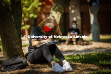 Kaitlin Goehring, freshman from Elkhorn, NE, sketches the scene in front of her. Chip Stanley's DSGN