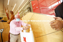 United States Secretary of Agriculture Sonny Perdue uses hand sanitizer produced by UNL Engineering 