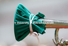 Band members have used ingenuity to cover their horn's bell. Cornhusker Marching Band practice in Co