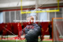 Drum Major Jacob Coughlin practices his mace twirl in a multiple exposure image. One third of the ma