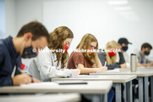 Honor's students work on a writing assignment. Honor’s Program learning assistant story in Knoll R