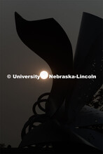 The sun rises over the Torn Notebook sculpture on city campus. September 14, 2020. 