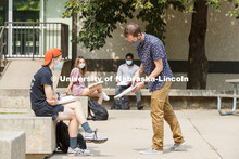 Ben Evjen, Assistant Professor of Practice, works with Preston Parry during his Design 2 class outsi