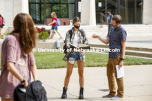 Ben Evjen, Assistant Professor of Practice, works with Morgan Murphy during his Design 2 class outsi