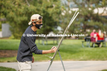 Saeed Almahrooqi works on his drawing for Chip Stanley's DSGN120 Design Drawing class. Outdoor class