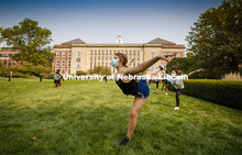 Sarah Mathis, a freshman from Lincoln, dances in Susan L Ourada's Modern Dance I class outside Love 