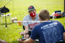 Jacob Uhlman discusses strategies with his groups. Assistant Professor Andrea Basche teachers her AG