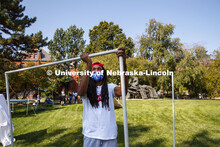 Maurice Knowles assembles his structure in the green space outside Architecture Hall. Students in Sh
