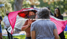 Analy Avila listens to Sharon Kuska's comments on her hat/structure. Students in ARCH 231 - Structur