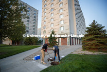 Shannon Bartelt-Hunt observes Spencer Perry, a graduate student in environmental engineering, take a