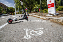 Scooters park in a designated area south of Love Library. September 28, 2020. 
