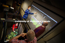Levi McKercher, (upper left) graduate student in the School of Natural Resources, and Ryan Moore, do