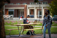 Seth Caines works on his chemistry homework on the greenspace outside the Nebraska Union. City Campu