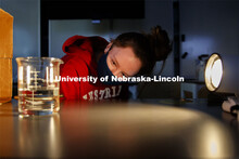 Raegan Hoyle, freshman from Fremont, Nebraska, watches for a reaction to light from her spinach leaf