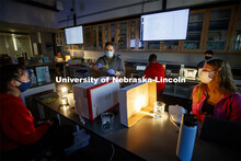 Daniel Gutzmann, Graduate Teaching Assistant in biological sciences, demonstrates taking samples fro