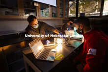 Daniel Gutzmann, Graduate Teaching Assistant in biological sciences, helps Clayton Keys, freshman fr