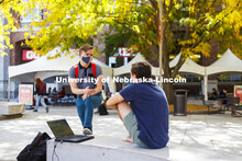 Ian Maltas, a junior from Lincoln, and Uri Harding, a junior from Omaha, talk during the noon hour o
